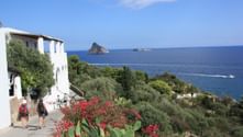View across Panarea to the rocky islands of Lisca Bianca and Bottaro View across Panarea